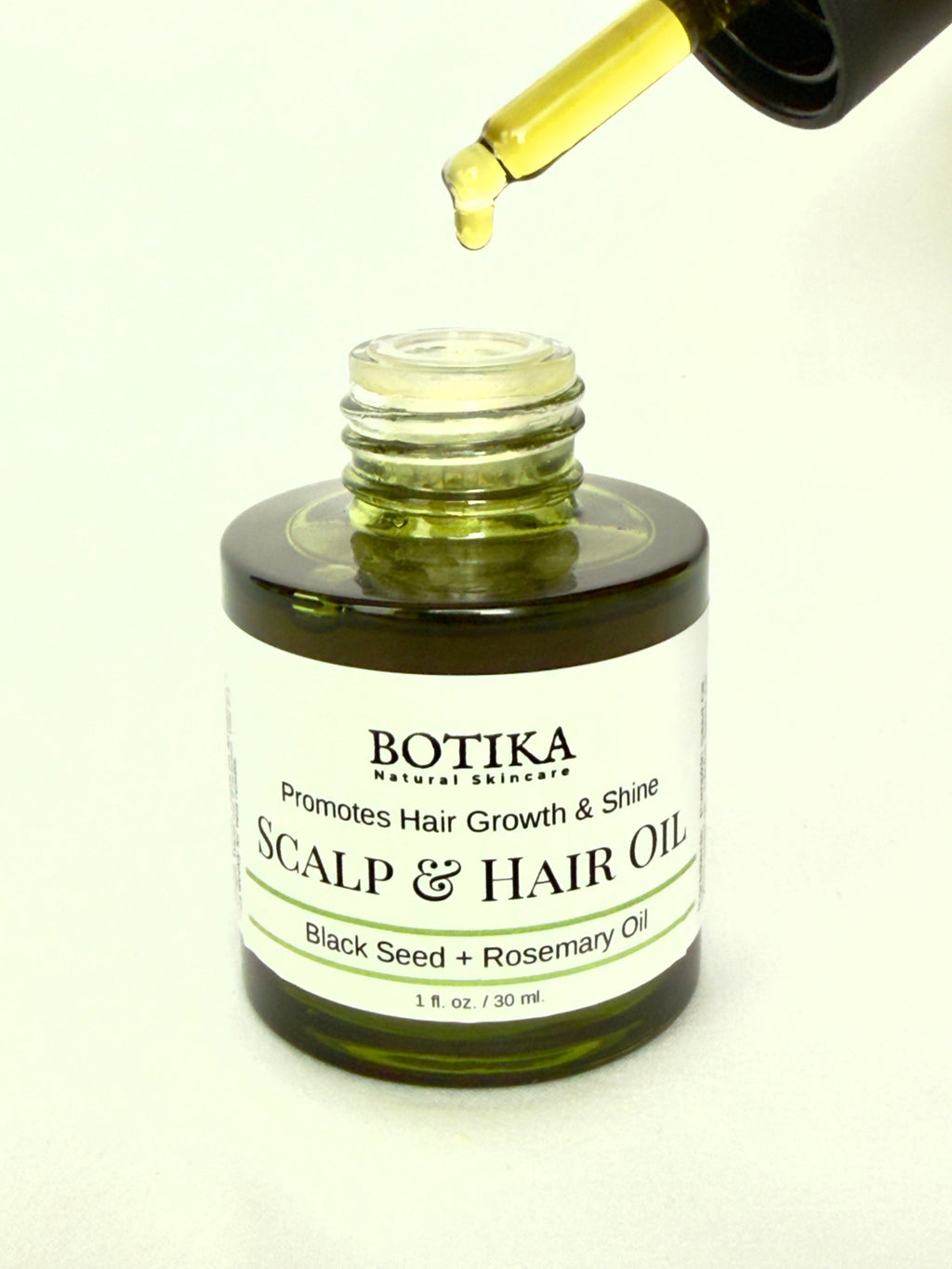 Aceite para el cuero cabelludo y el crecimiento del cabello con semilla negra y ashwagandha